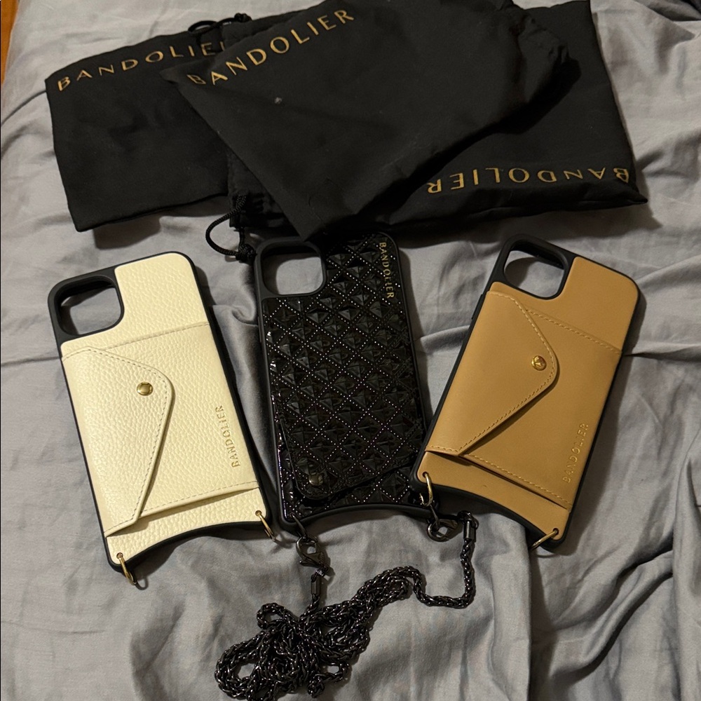 3 Bandolier Crossbody iPhone 14 Plus cases in Black, Cream & Tan w/ Card Pocket